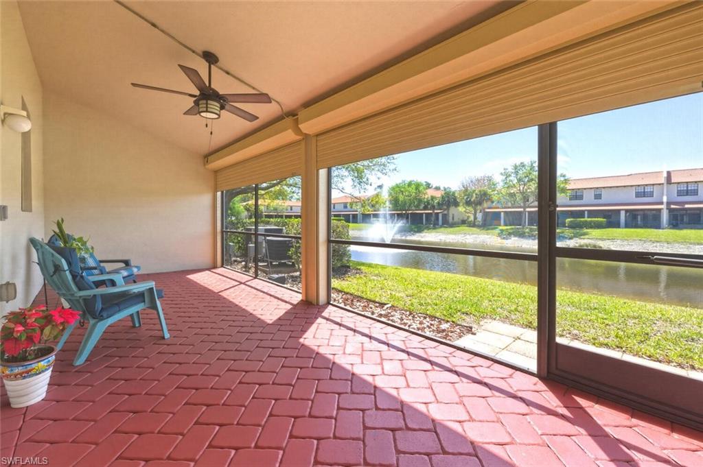 7577 Bristol Circle Naples, FL 34120 - Photo 28 of 41 a view of a porch with furniture and floor to ceiling window
