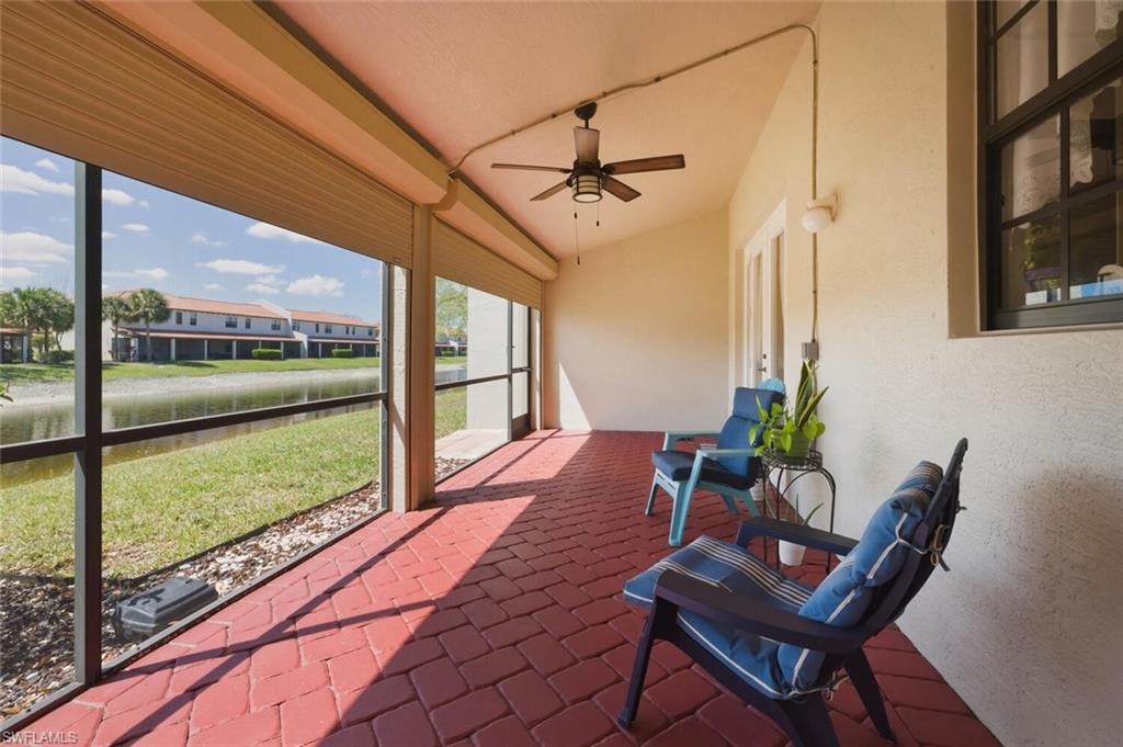 7577 Bristol Circle Naples, FL 34120 - Photo 29 of 41 a view of a porch with furniture and wooden floor