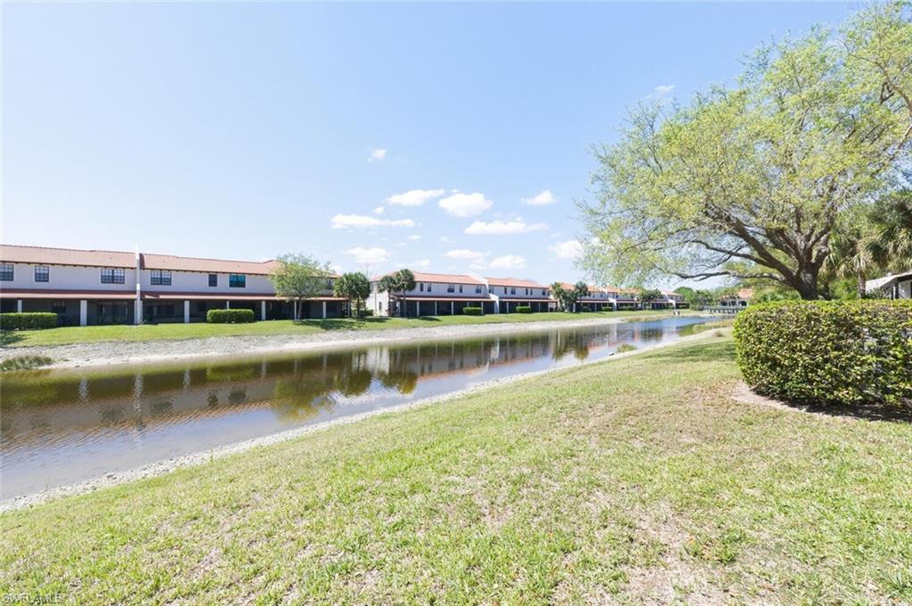 7577 Bristol Circle Naples, FL 34120 - Photo 30 of 41 a view of a lake with houses