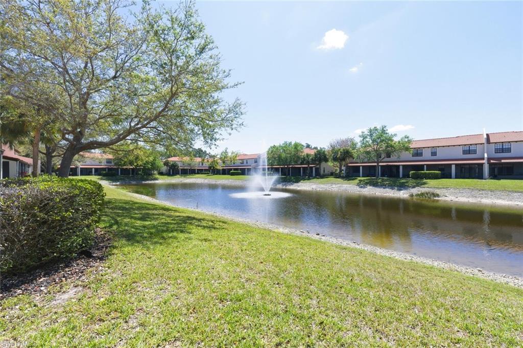 7577 Bristol Circle Naples, FL 34120 - Photo 33 of 41 a view of a lake with houses