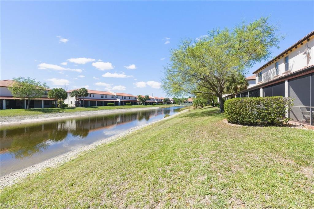 7577 Bristol Circle Naples, FL 34120 - Photo 34 of 41 a view of a lake with houses