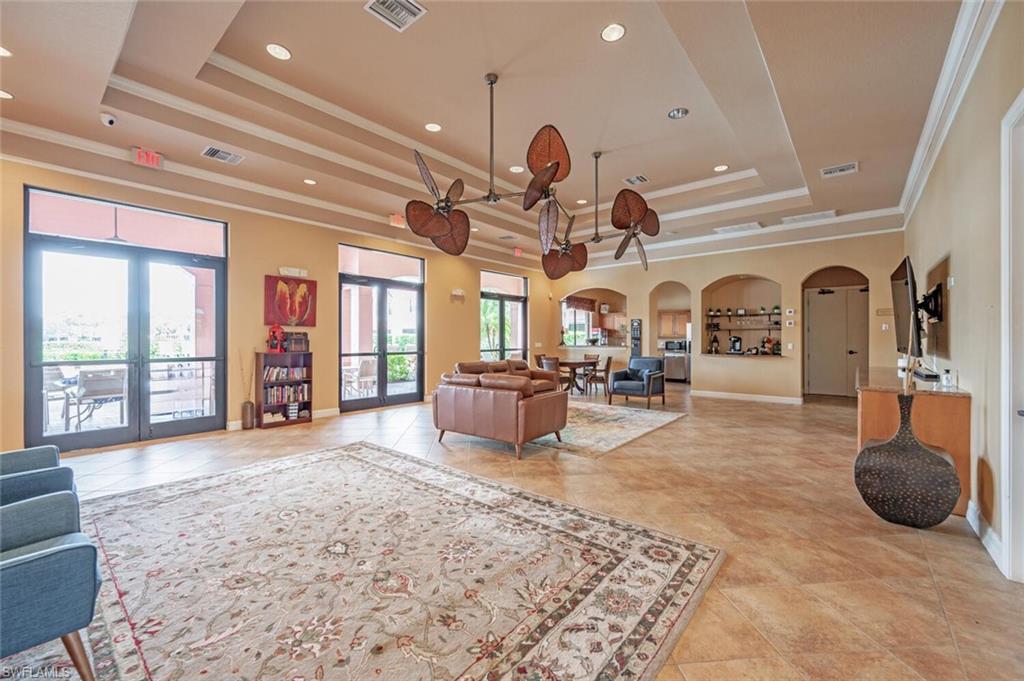 7577 Bristol Circle Naples, FL 34120 - Photo 40 of 41 a living room with fireplace furniture and a large window