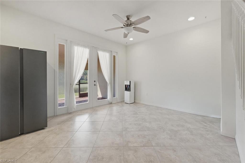 7577 Bristol Circle Naples, FL 34120 - Photo 4 of 41 an empty room with windows and fan