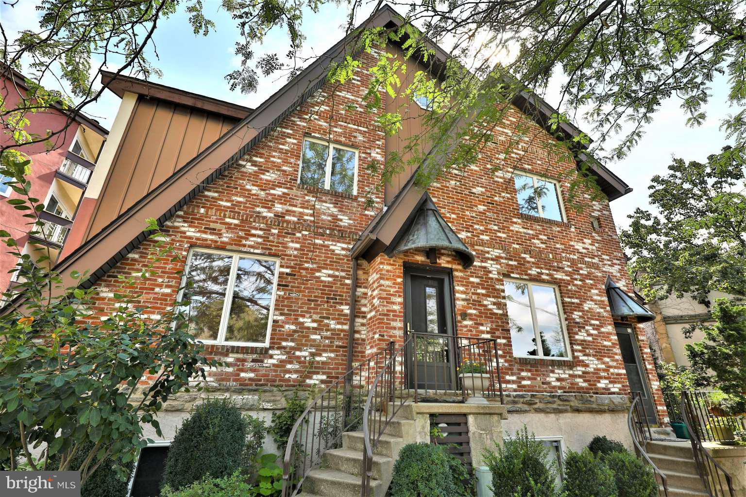 8 Rex Avenue, Unit 11 Philadelphia, PA 19118 - Photo 1 of 25 front view of a house with a street