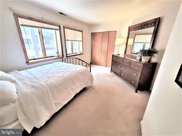 a view of kitchen with furniture and floor to ceiling window