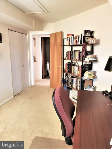 a view of a livingroom with wooden floor and stairs