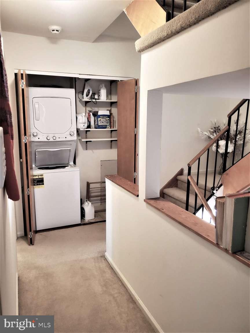 8 Rex Avenue, Unit 11 Philadelphia, PA 19118 - Photo 17 of 25 a view of a livingroom with wooden floor and stairs