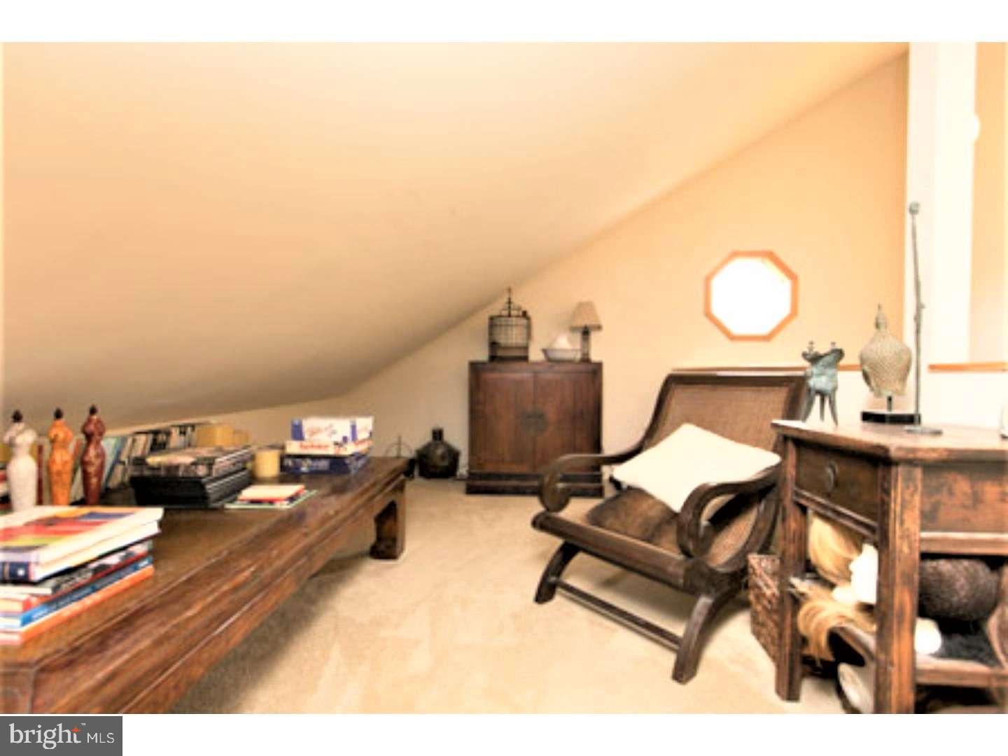 8 Rex Avenue, Unit 11 Philadelphia, PA 19118 - Photo 18 of 25 a living room with furniture