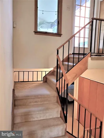 a outdoor living space with furniture and a potted plant