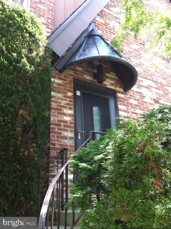 a view of a wooden door of the house