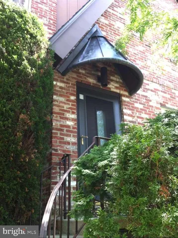a view of a wooden door of the house