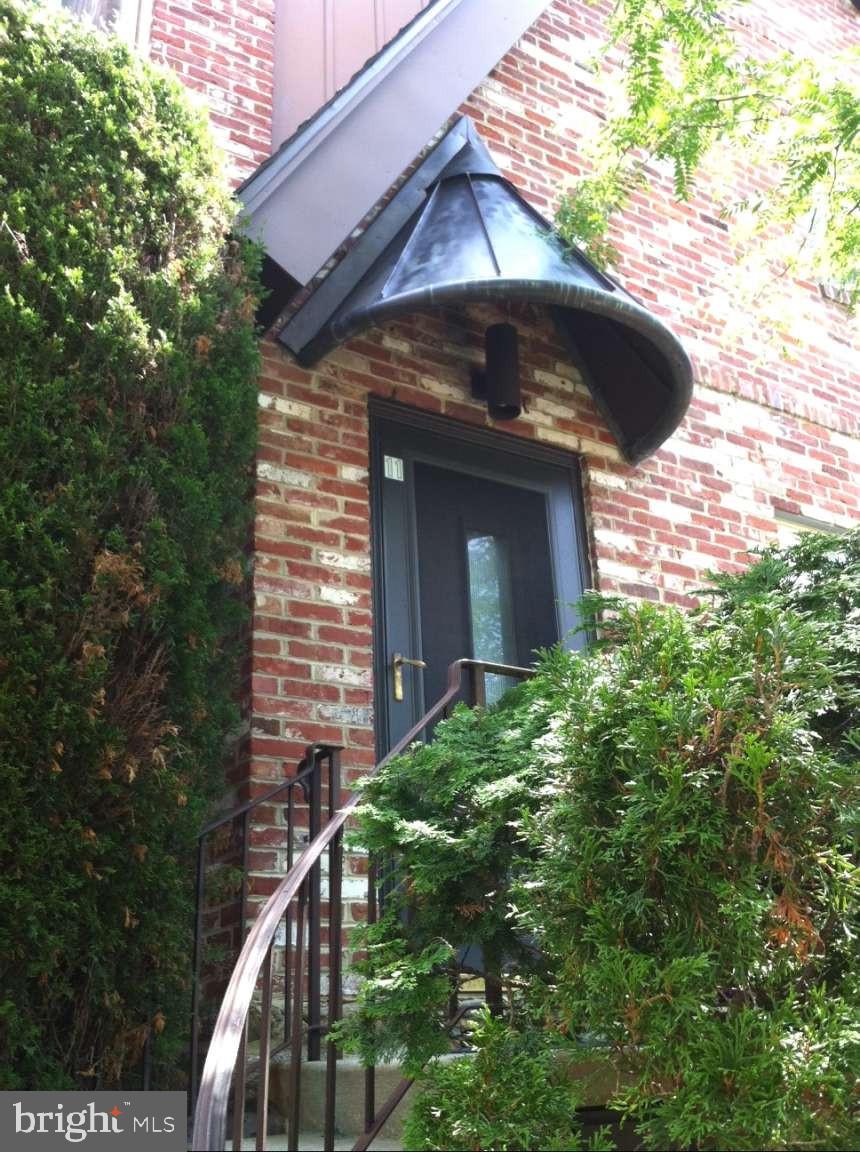 8 Rex Avenue, Unit 11 Philadelphia, PA 19118 - Photo 2 of 25 a view of a wooden door of the house