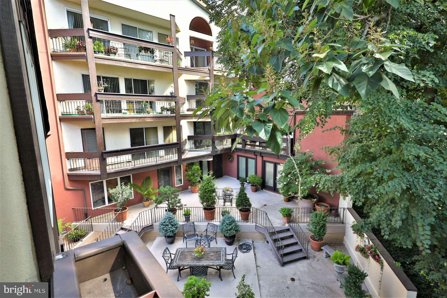 8 Rex Avenue, Unit 11 Philadelphia, PA 19118 - Photo 22 of 25 a view of balcony with outdoor seating and plants