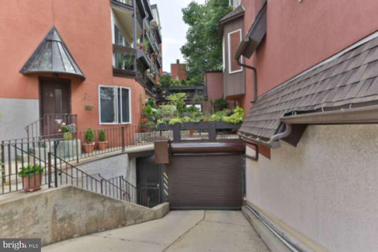 8 Rex Avenue, Unit 11 Philadelphia, PA 19118 - Photo 3 of 25 a view of a patio with couches and potted plants