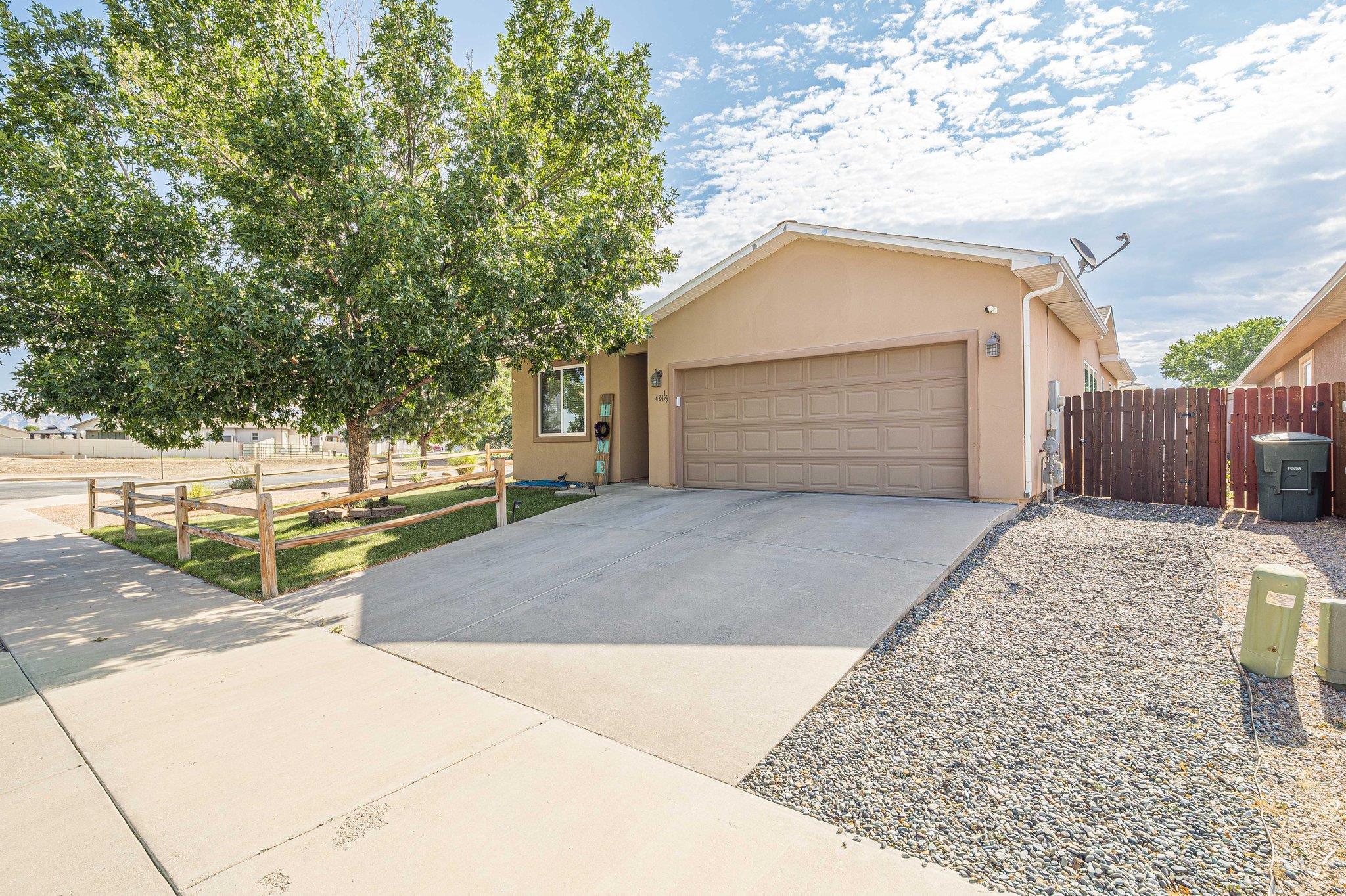 424 1/2 29 1/2 Road Grand Junction, CO 81504 - Photo 1 of 40 a view of garage yard and tree