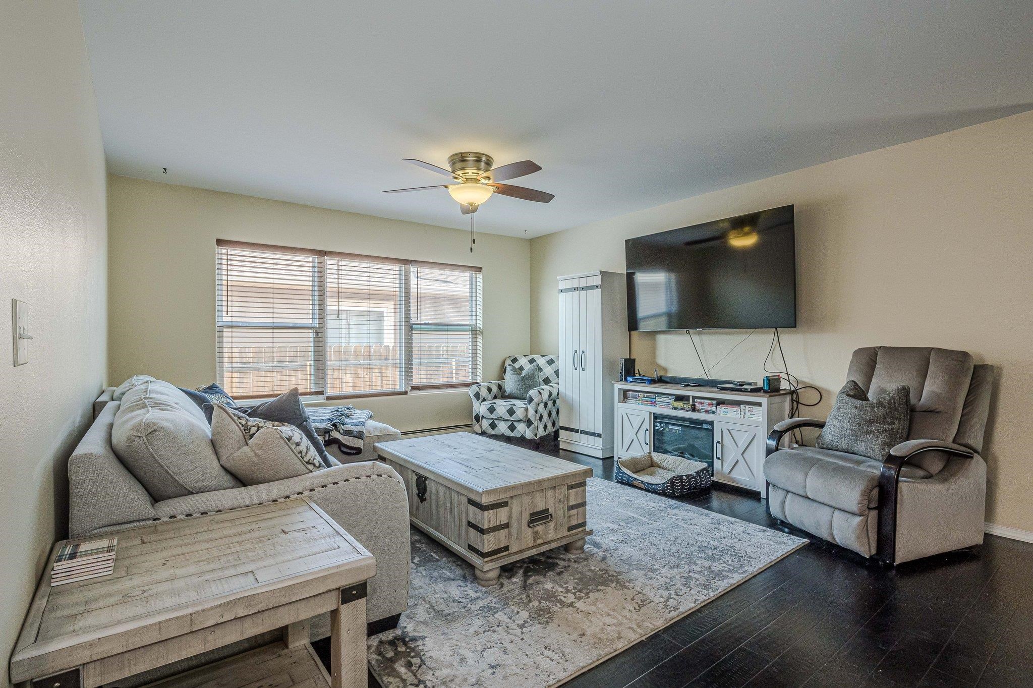 424 1/2 29 1/2 Road Grand Junction, CO 81504 - Photo 11 of 40 a living room with furniture and a flat screen tv