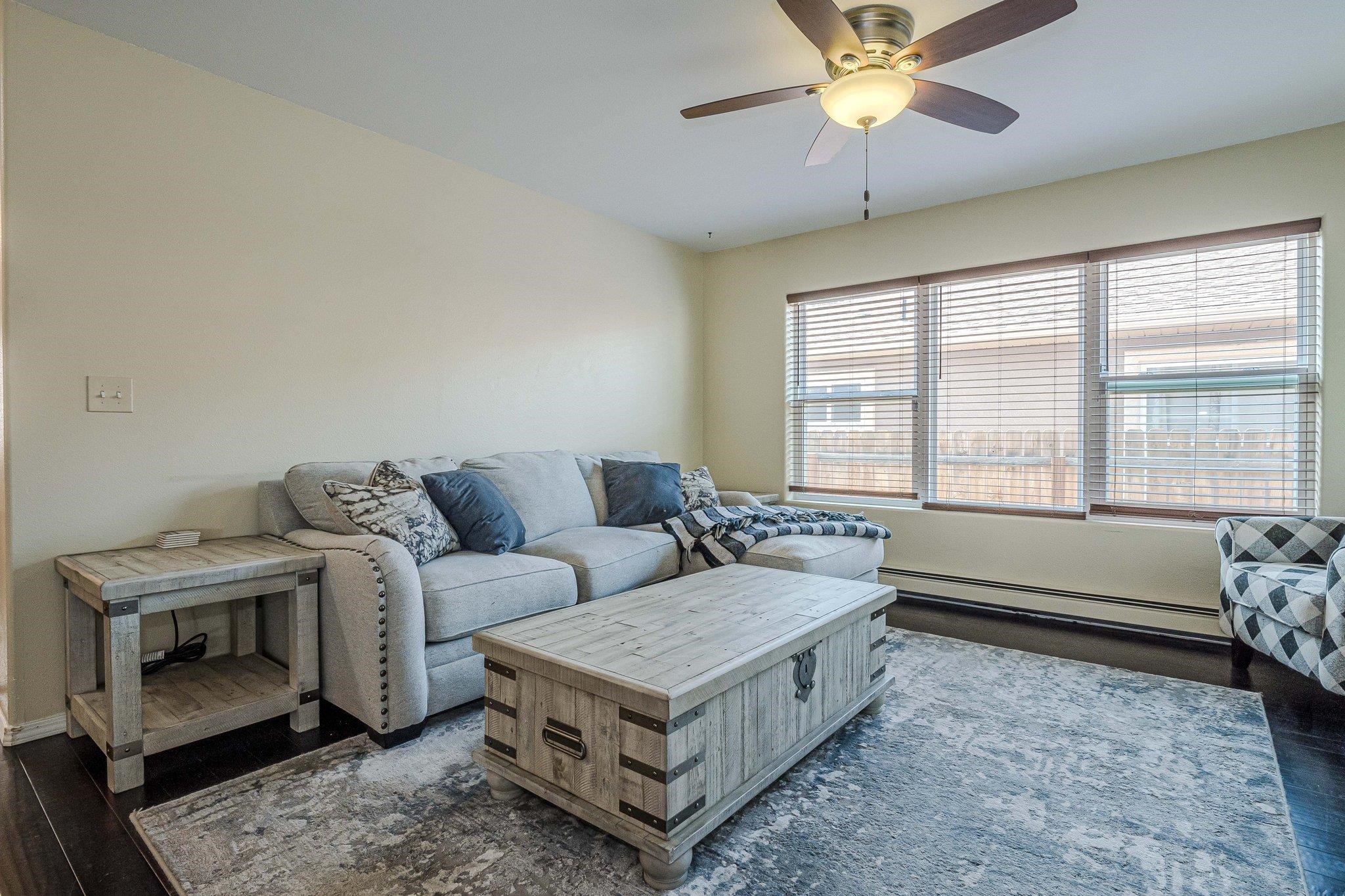 424 1/2 29 1/2 Road Grand Junction, CO 81504 - Photo 13 of 40 a living room with furniture and a large window