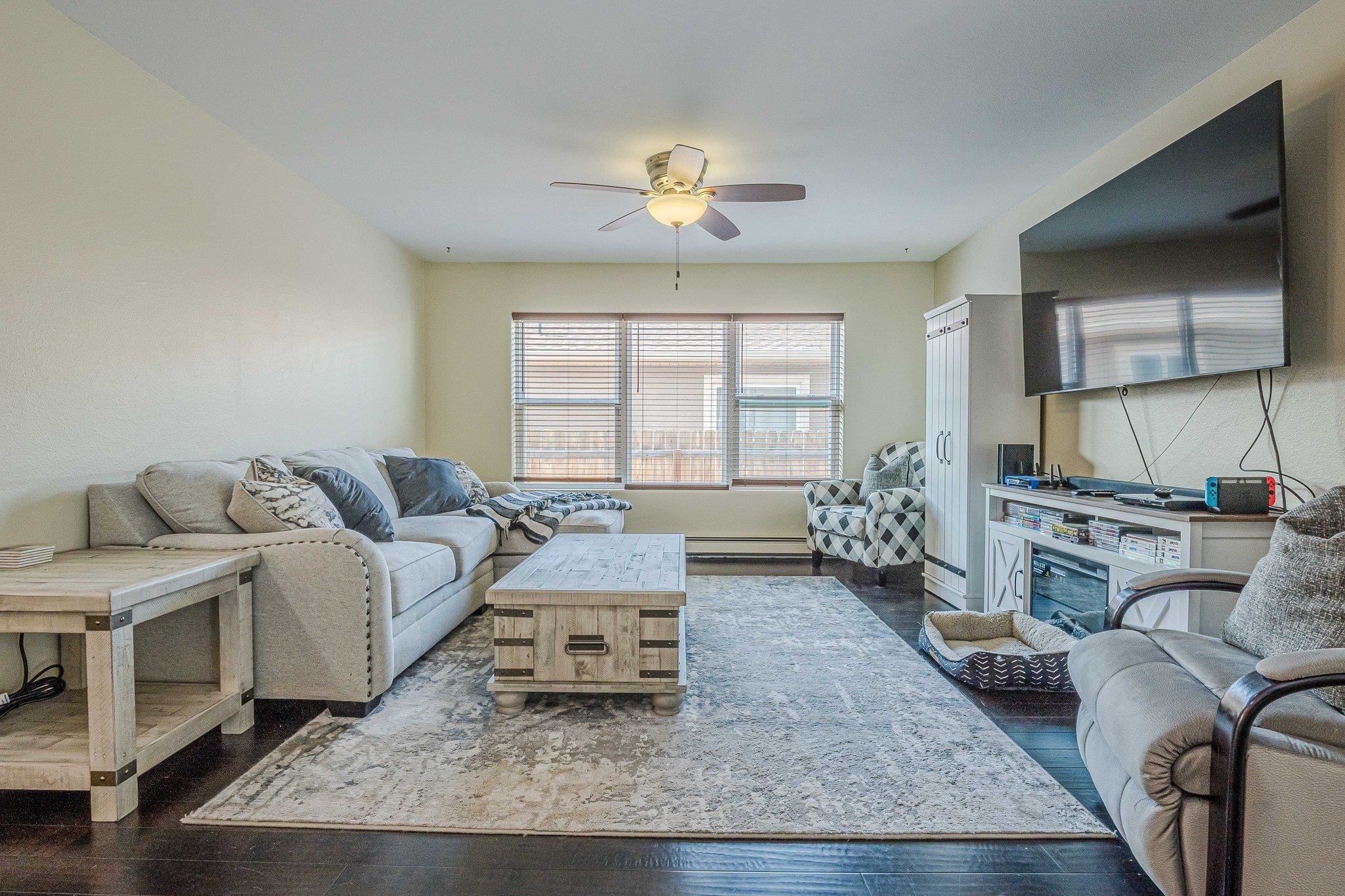 424 1/2 29 1/2 Road Grand Junction, CO 81504 - Photo 14 of 40 a living room with furniture and a chandelier