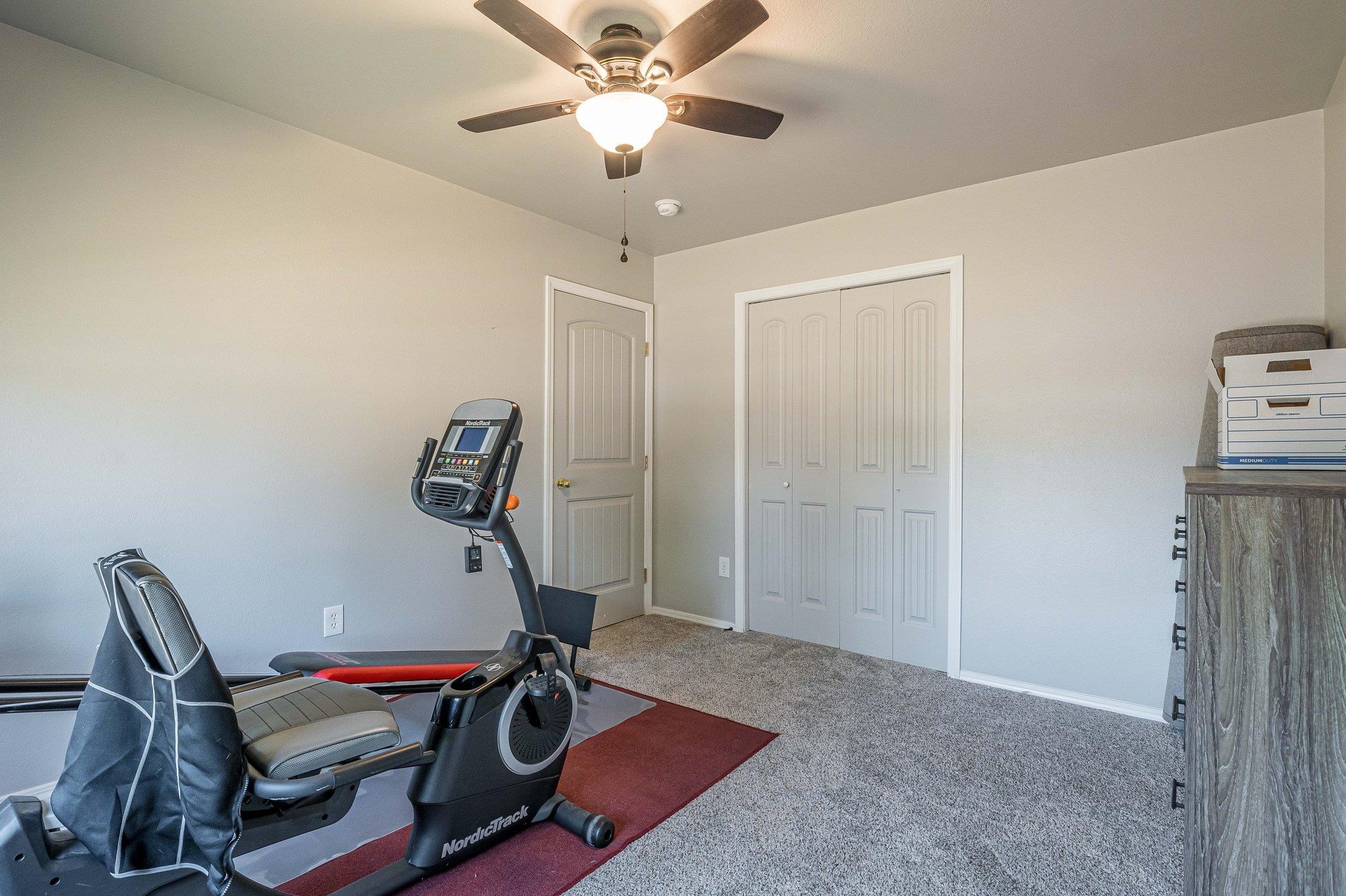 424 1/2 29 1/2 Road Grand Junction, CO 81504 - Photo 16 of 40 a room with gym equipment and view of chandelier
