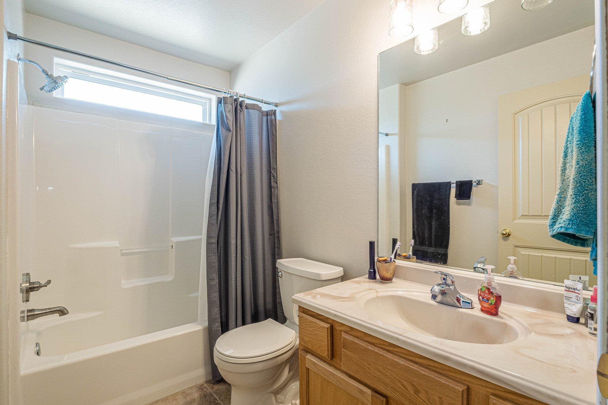 424 1/2 29 1/2 Road Grand Junction, CO 81504 - Photo 18 of 40 a bathroom with a sink toilet and shower