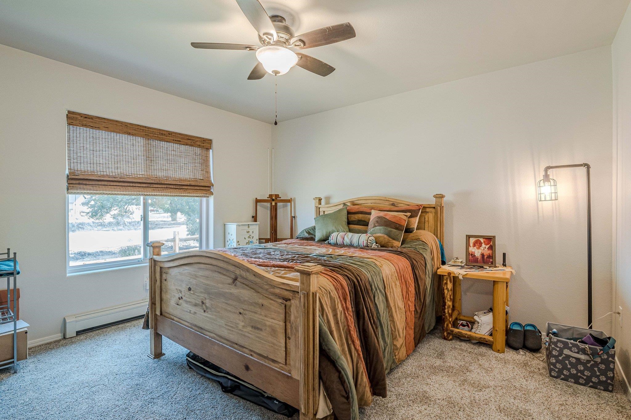 424 1/2 29 1/2 Road Grand Junction, CO 81504 - Photo 19 of 40 a bedroom with a bed and a chandelier