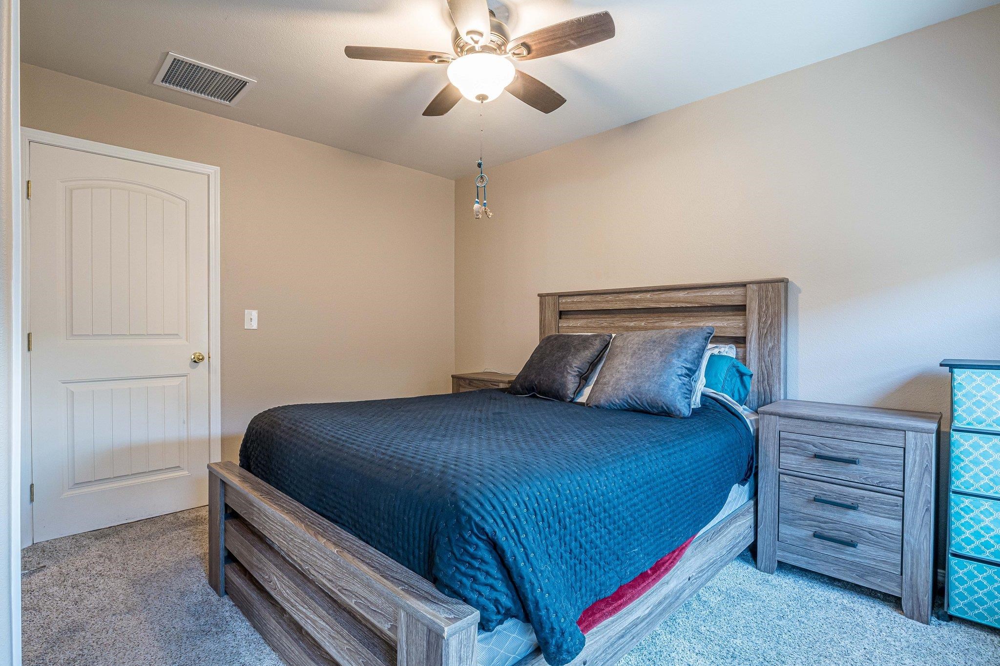 424 1/2 29 1/2 Road Grand Junction, CO 81504 - Photo 24 of 40 a bedroom with a bed and a ceiling fan