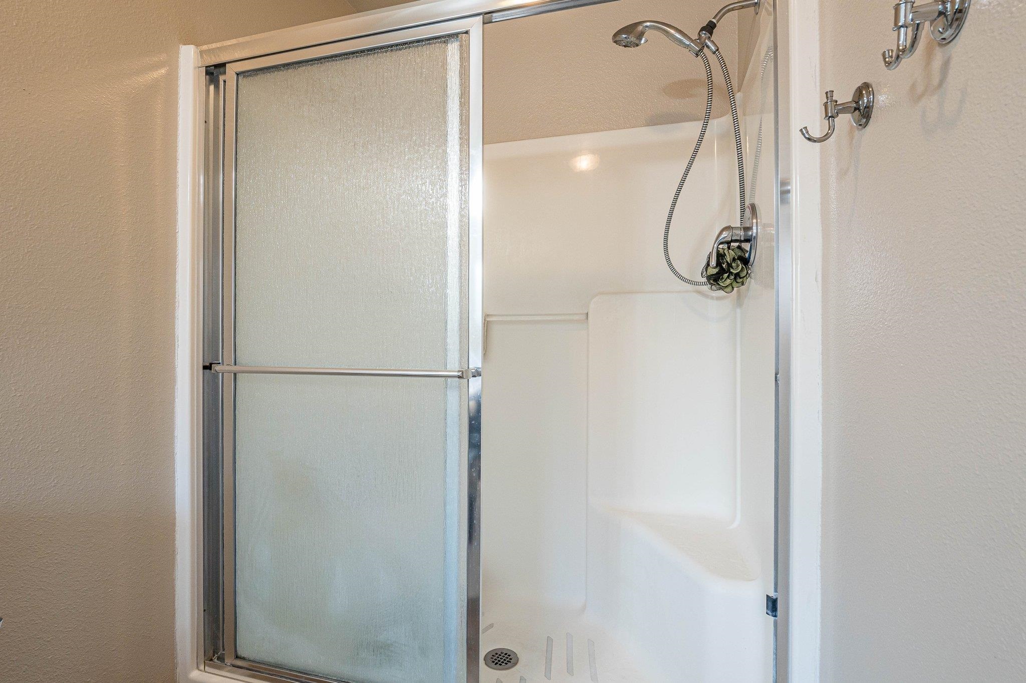 424 1/2 29 1/2 Road Grand Junction, CO 81504 - Photo 29 of 40 a bathroom with a glass shower door