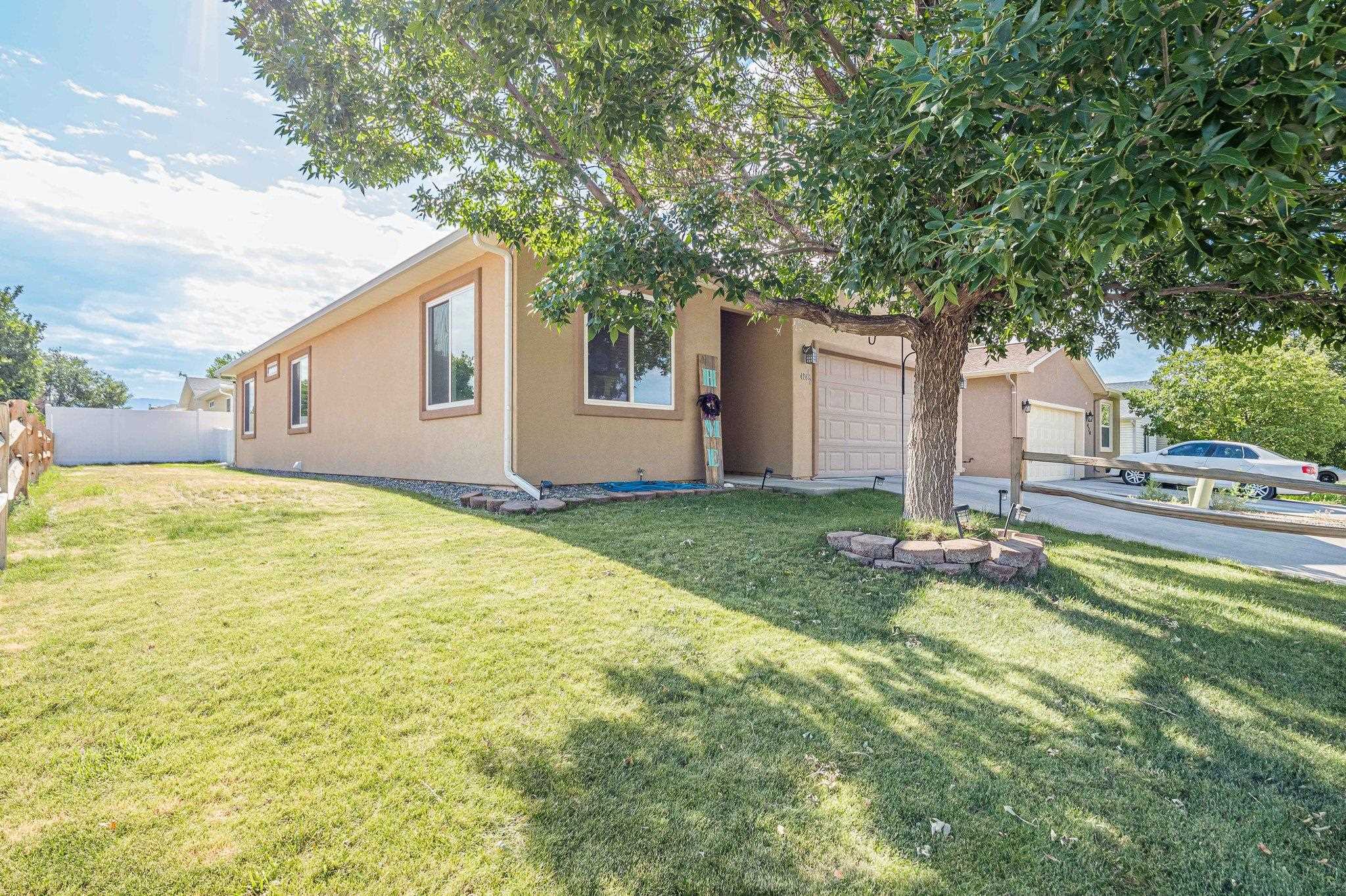 424 1/2 29 1/2 Road Grand Junction, CO 81504 - Photo 3 of 40 a house with swimming pool in front of it
