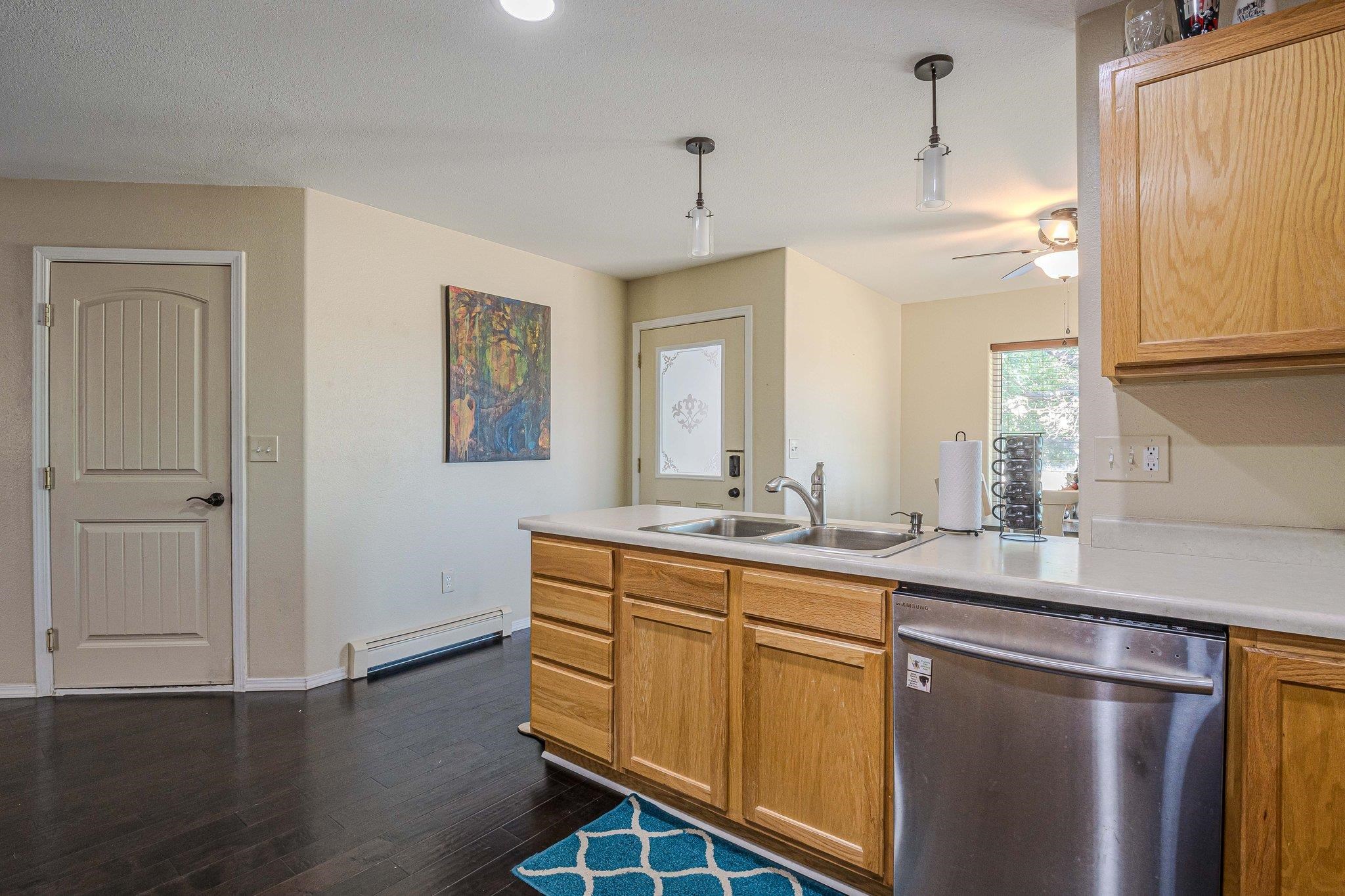 424 1/2 29 1/2 Road Grand Junction, CO 81504 - Photo 10 of 40 a kitchen with sink cabinets and wooden floor