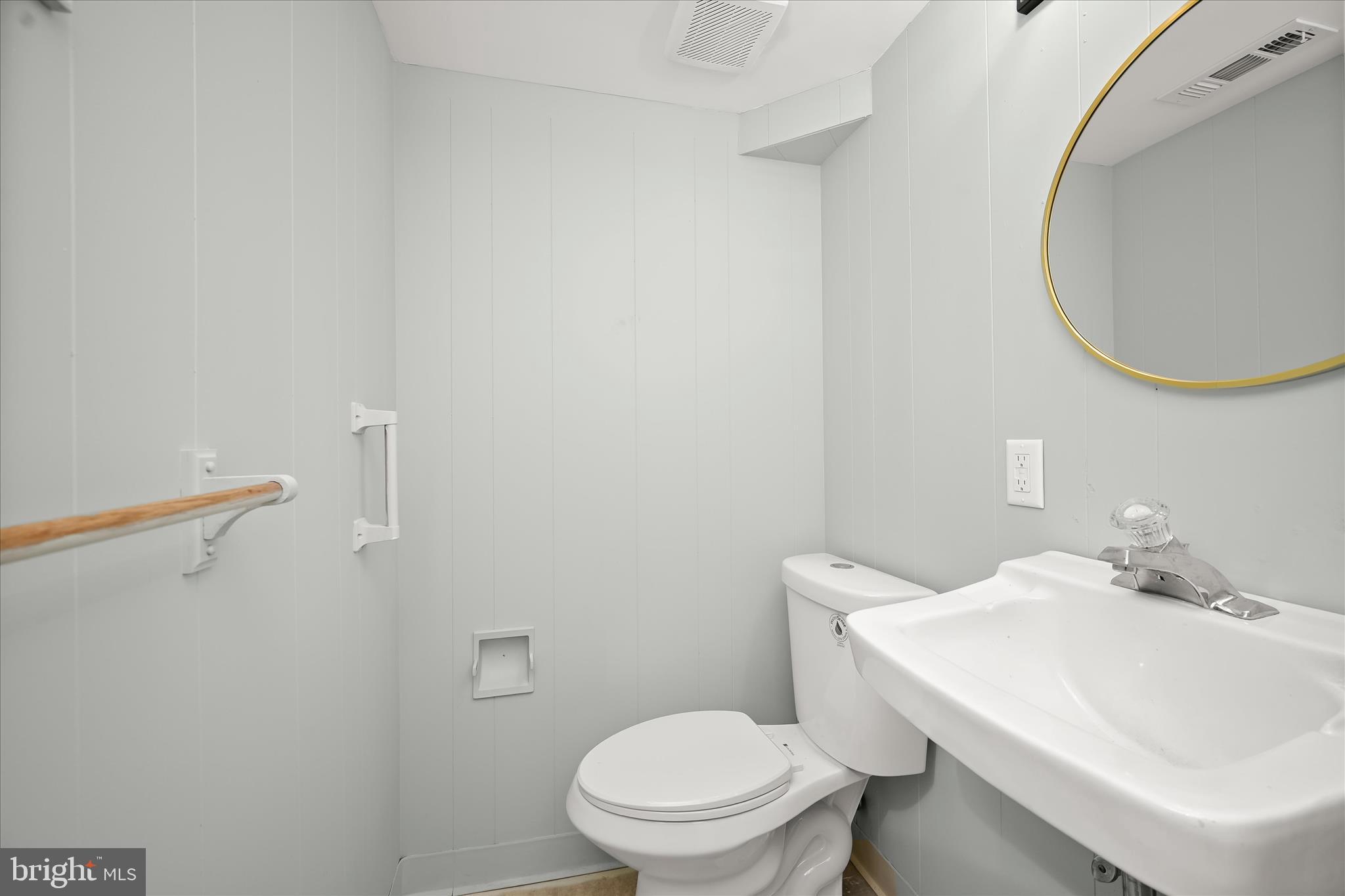 9720 Hedin Drive Silver Spring, MD 20903 - Photo 56 of 79 a bathroom with a sink a toilet and a mirror