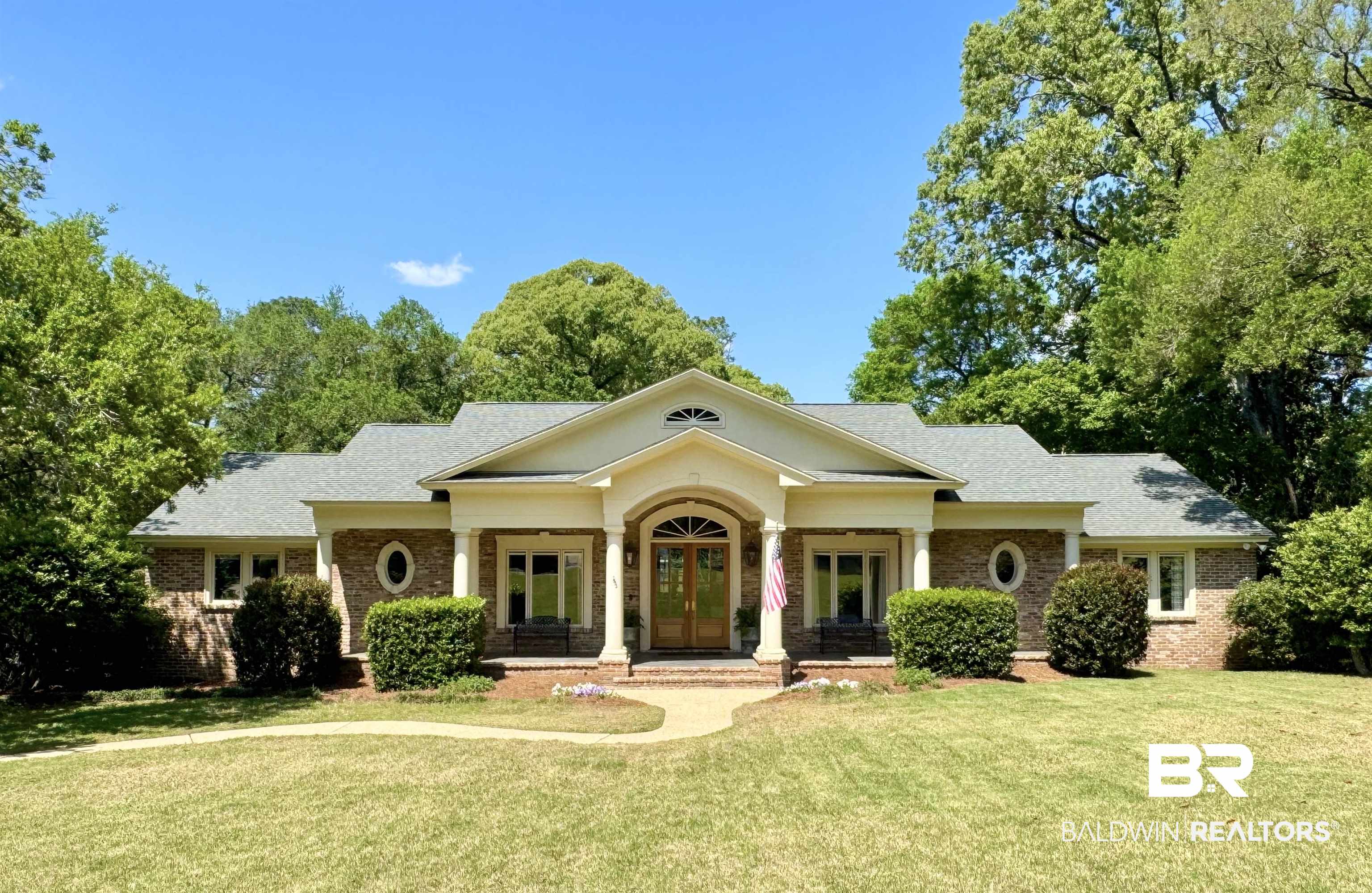 4 Kingsway Mobile, AL 36608 - Photo 1 of 44 View of front of home featuring roof with shingles, a front yard, brick siding, and french doors