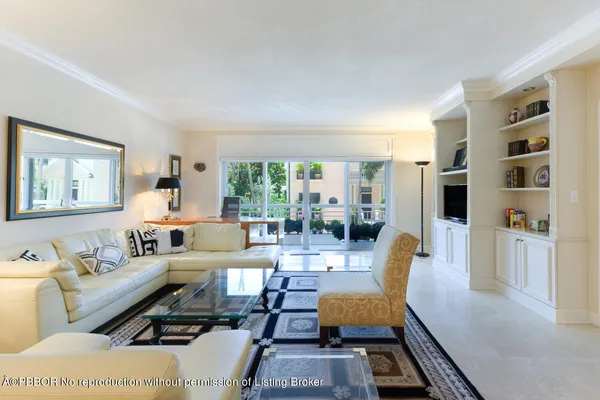 a dining room with furniture a rug and wooden floor