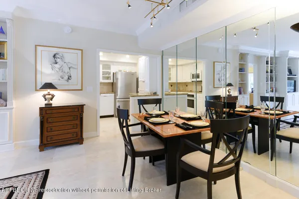 a kitchen with stainless steel appliances kitchen island granite countertop a stove a sink and a microwave