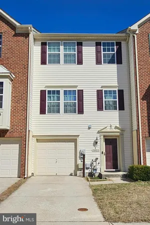a front view of a house with yard