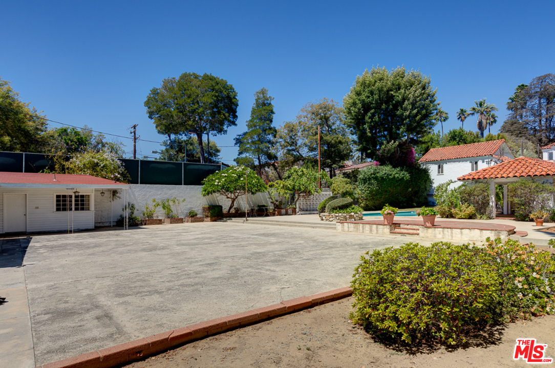 1003 Benedict Canyon Drive Beverly Hills, CA 90210 - Photo 33 of 35 a house view with a outdoor space
