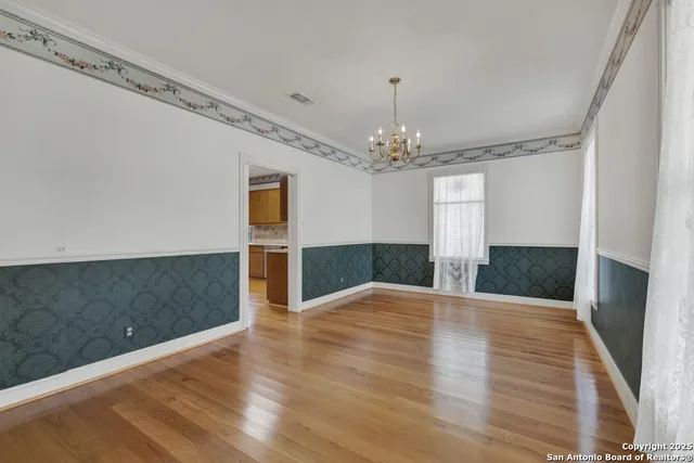 a view of a livingroom with wooden floor
