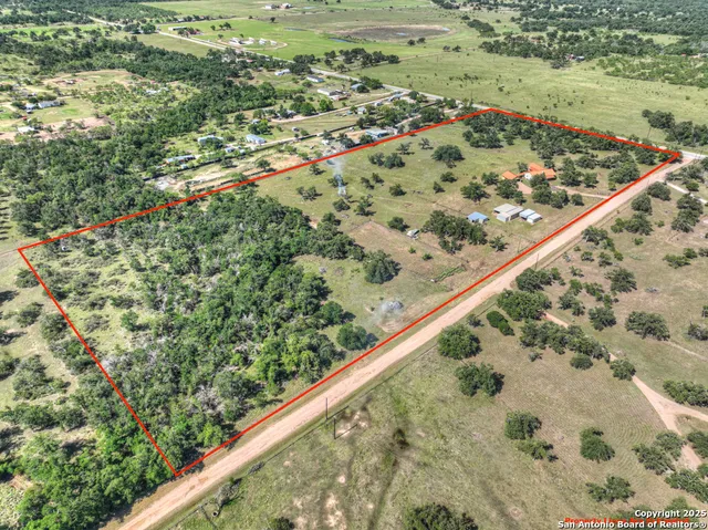 a view of a lush green field with lots of green space