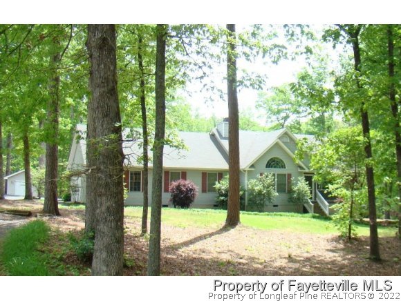 241 Hardy Road Carthage, NC 28327 - Photo 1 of 12 a view of a yard in front of a house with a tree