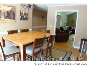 241 Hardy Road Carthage, NC 28327 - Photo 5 of 12 a view of a dining room with furniture and wooden floor