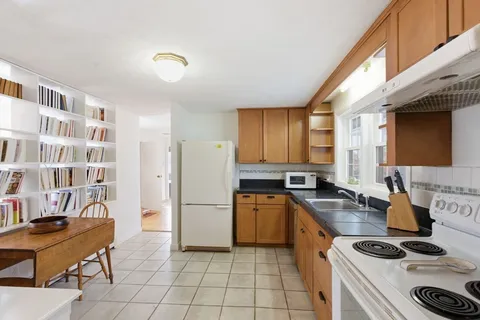 a kitchen with a sink a stove and refrigerator