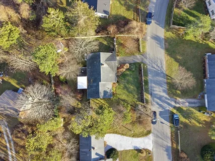 an aerial view of residential houses with outdoor space
