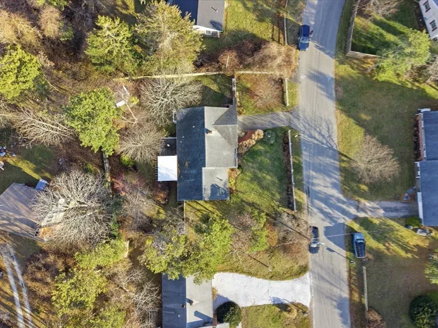an aerial view of residential houses with outdoor space