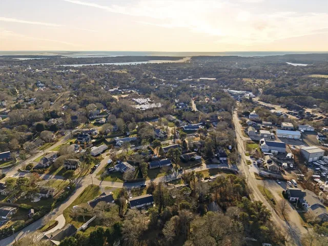 an aerial view of residential houses with city view