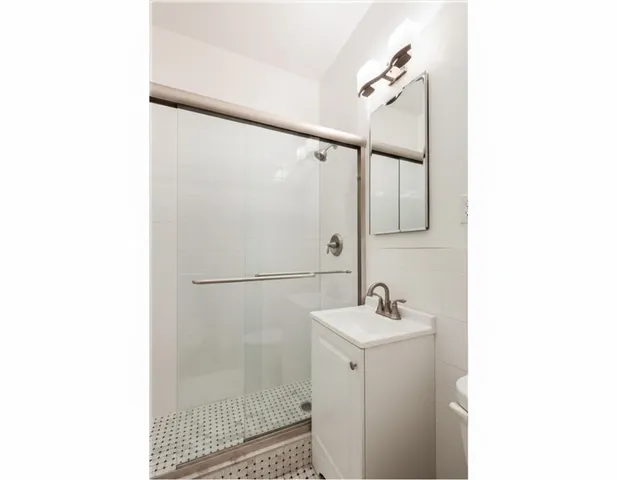 a bathroom with a sink and mirror