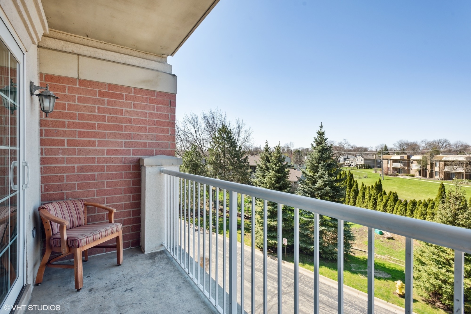701 West Rand Road, Unit 330 Arlington Heights, IL 60004 - Photo 15 of 16 a view of a chair and table in the balcony