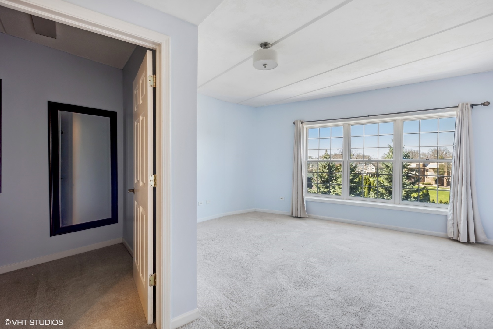 701 West Rand Road, Unit 330 Arlington Heights, IL 60004 - Photo 8 of 16 an empty room with windows and view