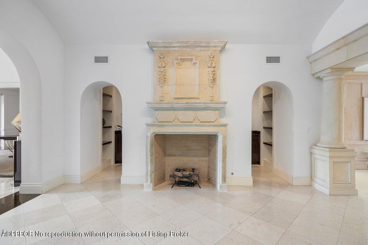 168 Kings Road Palm Beach, FL 33480 - Photo 12 of 51 a view of an empty room with fireplace and a window