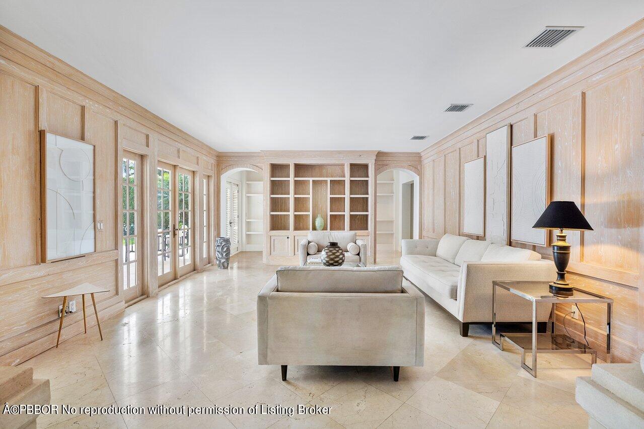 168 Kings Road Palm Beach, FL 33480 - Photo 23 of 51 a living room with furniture and a large window