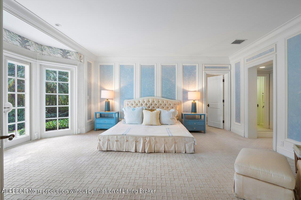 168 Kings Road Palm Beach, FL 33480 - Photo 27 of 51 a bedroom with a large bed and a couch