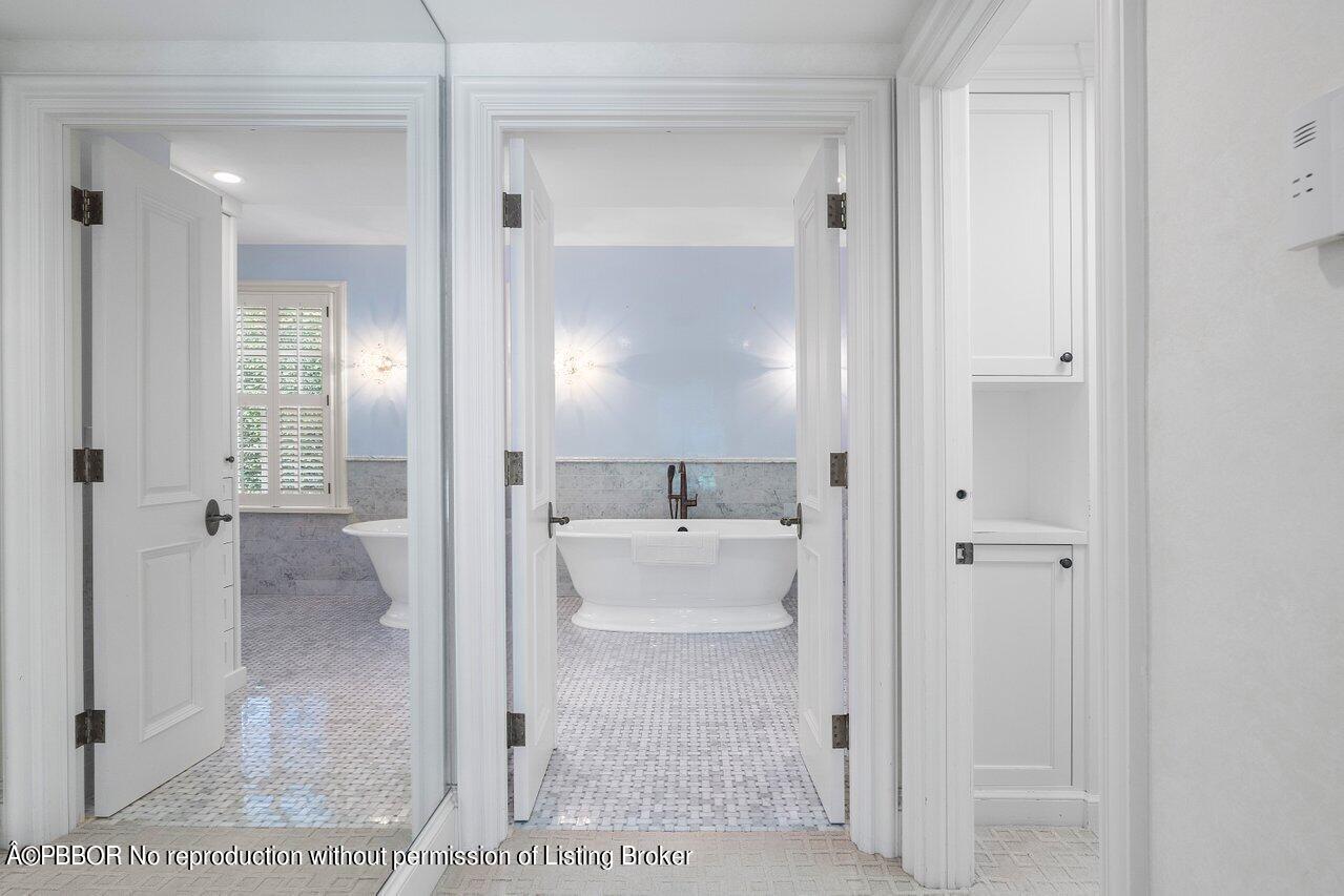 168 Kings Road Palm Beach, FL 33480 - Photo 32 of 51 a bathroom with a sink and mirror